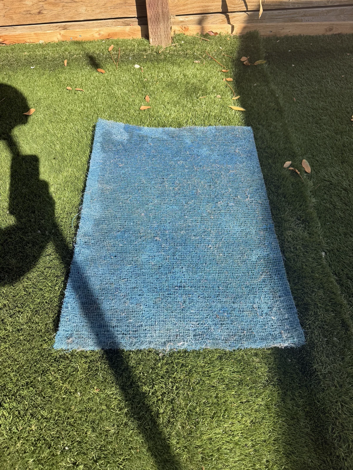 The same blue AC filter after dust has been cleaned away.