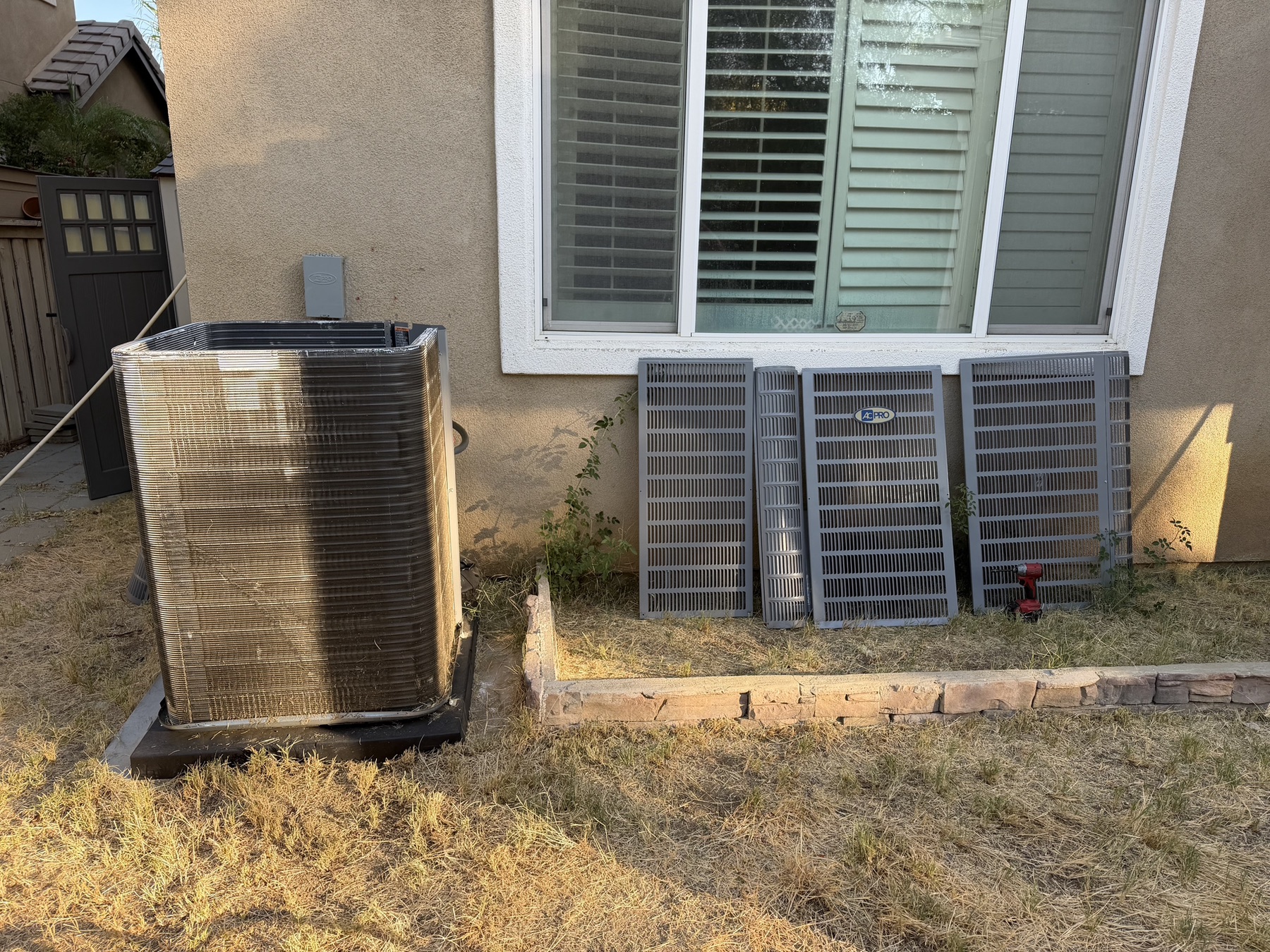 Outdoor AC unit prepared for cleaning and inspection